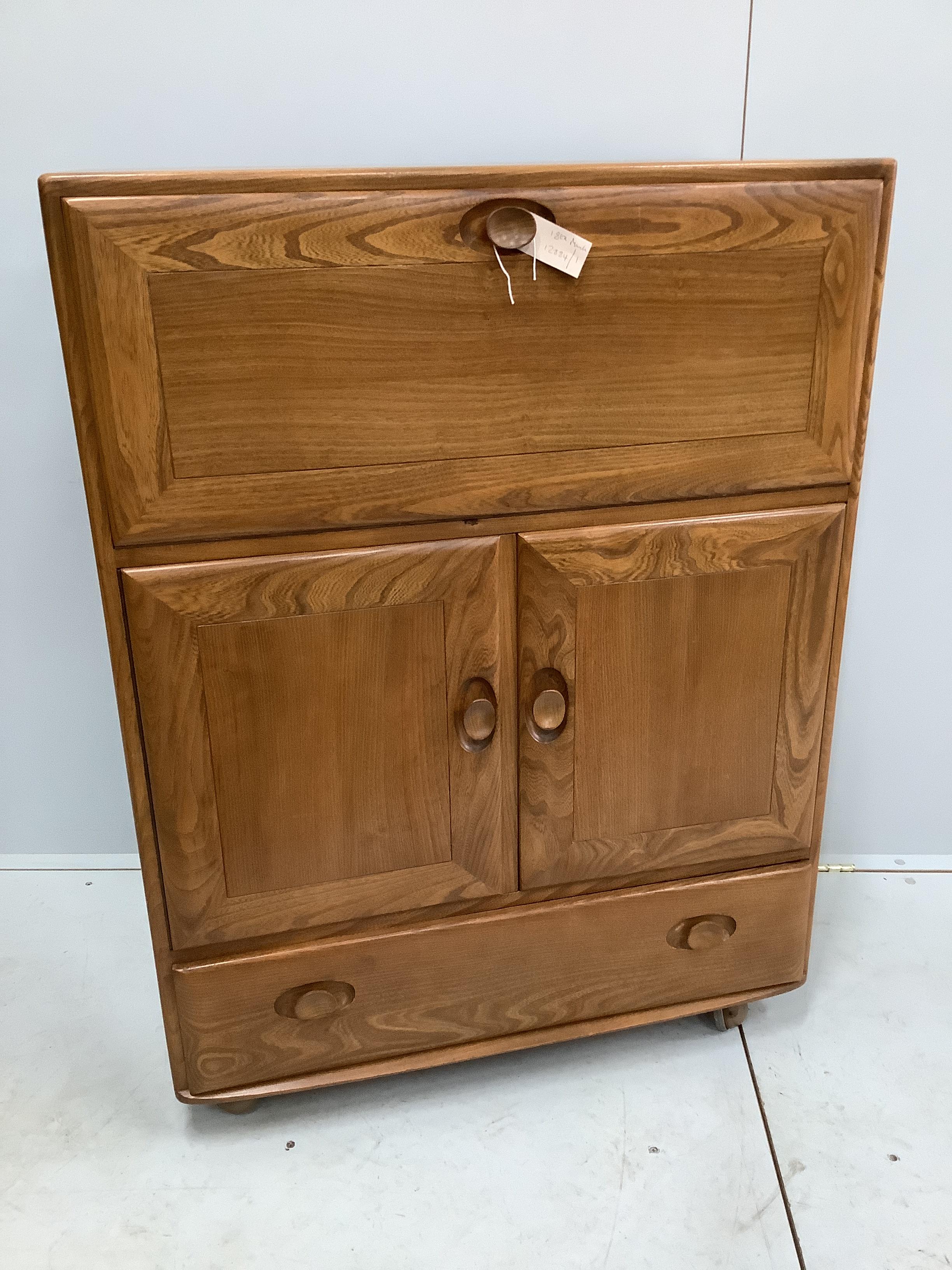 An Ercol elm bureau / cabinet, width 82cm, depth 44cm, height 109cm